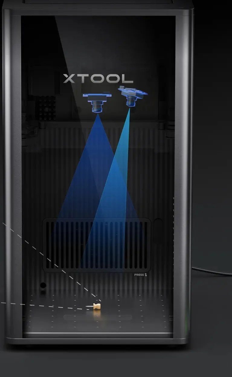 Interior da xTool F2 Ultra com as duas câmeras iluminando a mesa